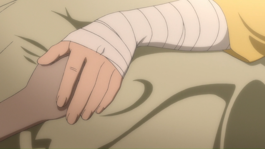 a screenshot of someone with a bandaged arm covering another person's hand with theirs